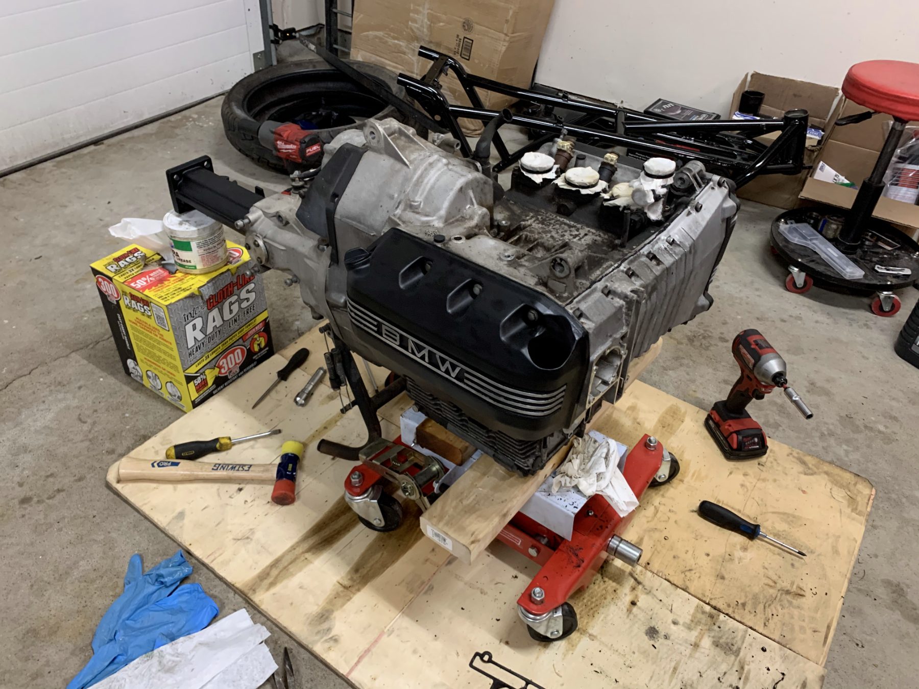 Powder-coated frame lowered over the engine